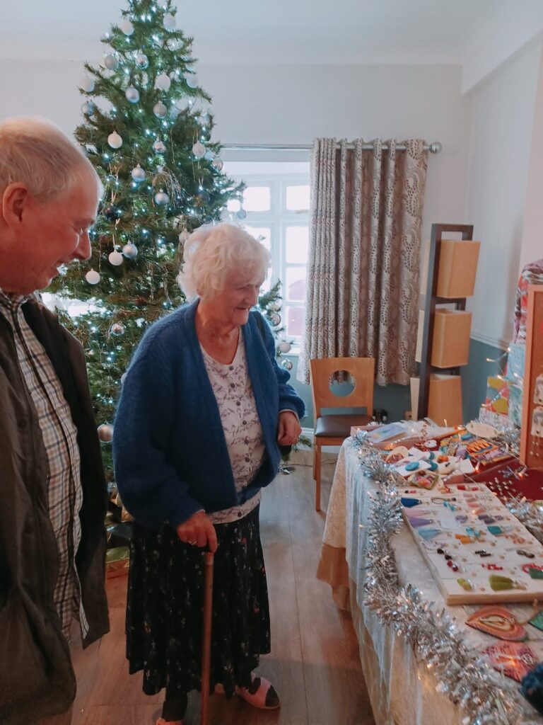 residents looking at stands at the christmas fayre