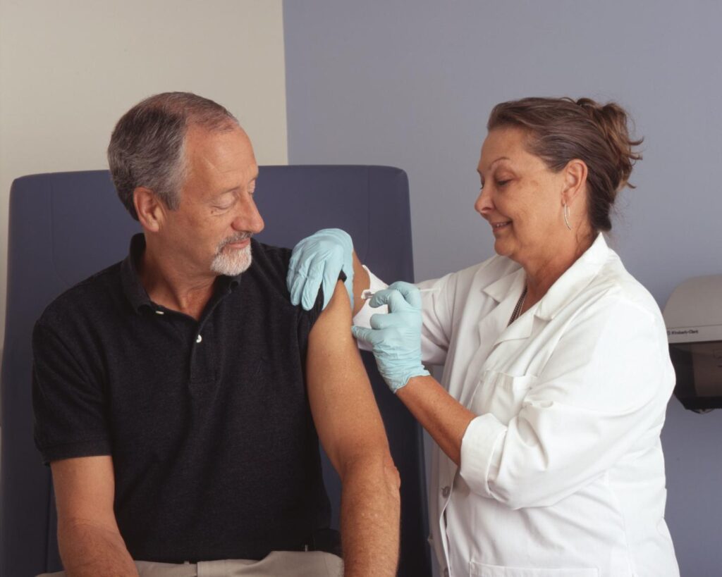 Nurse giving a patient an injection