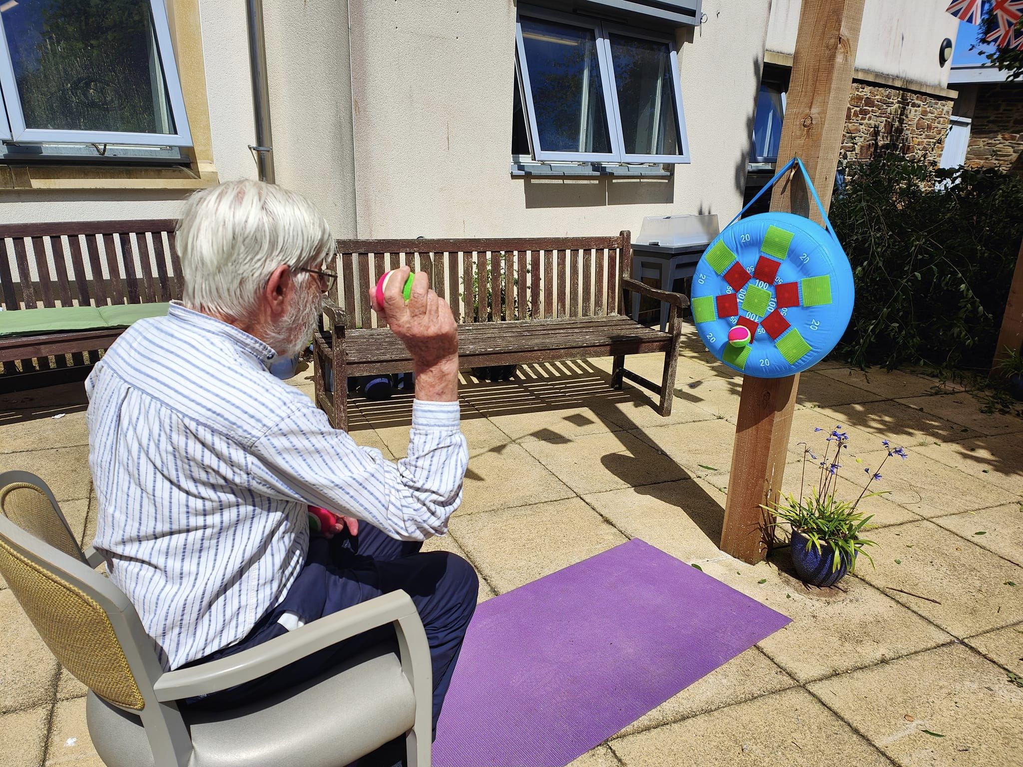 A resident playing a target game