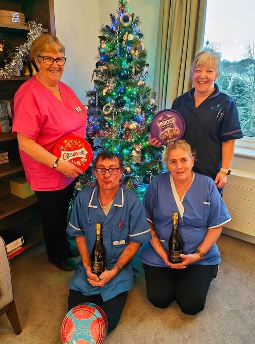 Staff with festive gifts