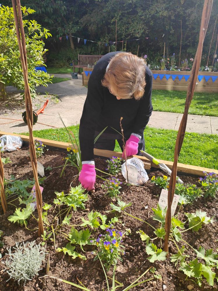 resident doing gardening