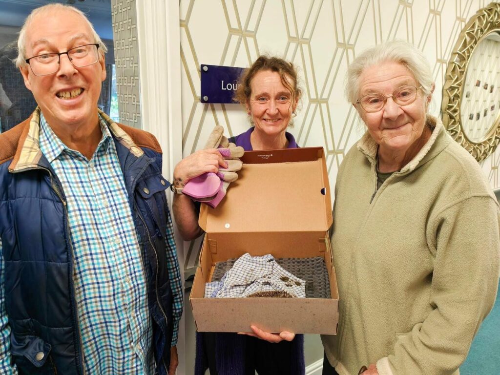 residents with a hedgehog