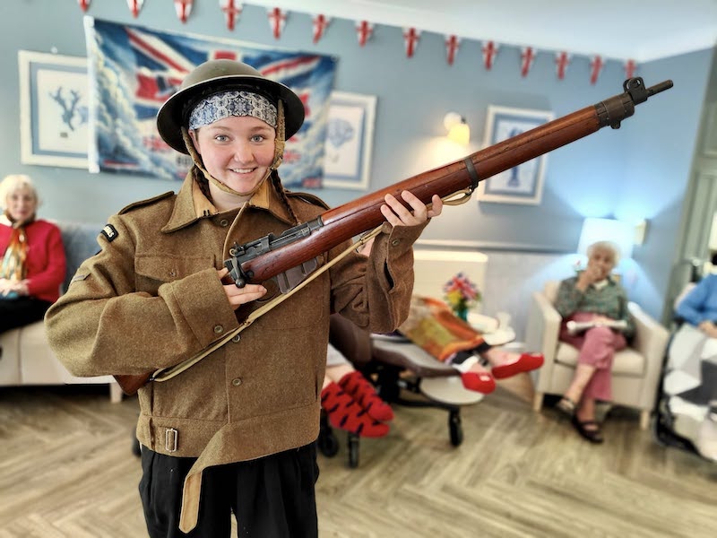 young woman holding a gun