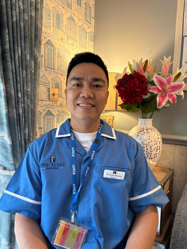 man smiling at the camera posing for a staff photo