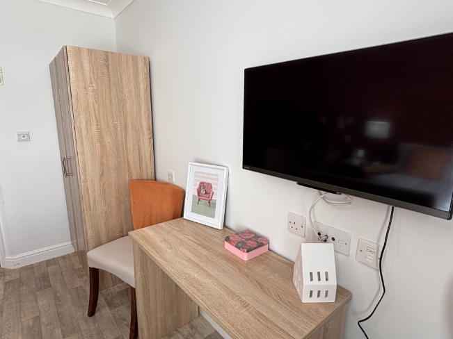 Bedroom Tv on the wall at The Fleet Care Home